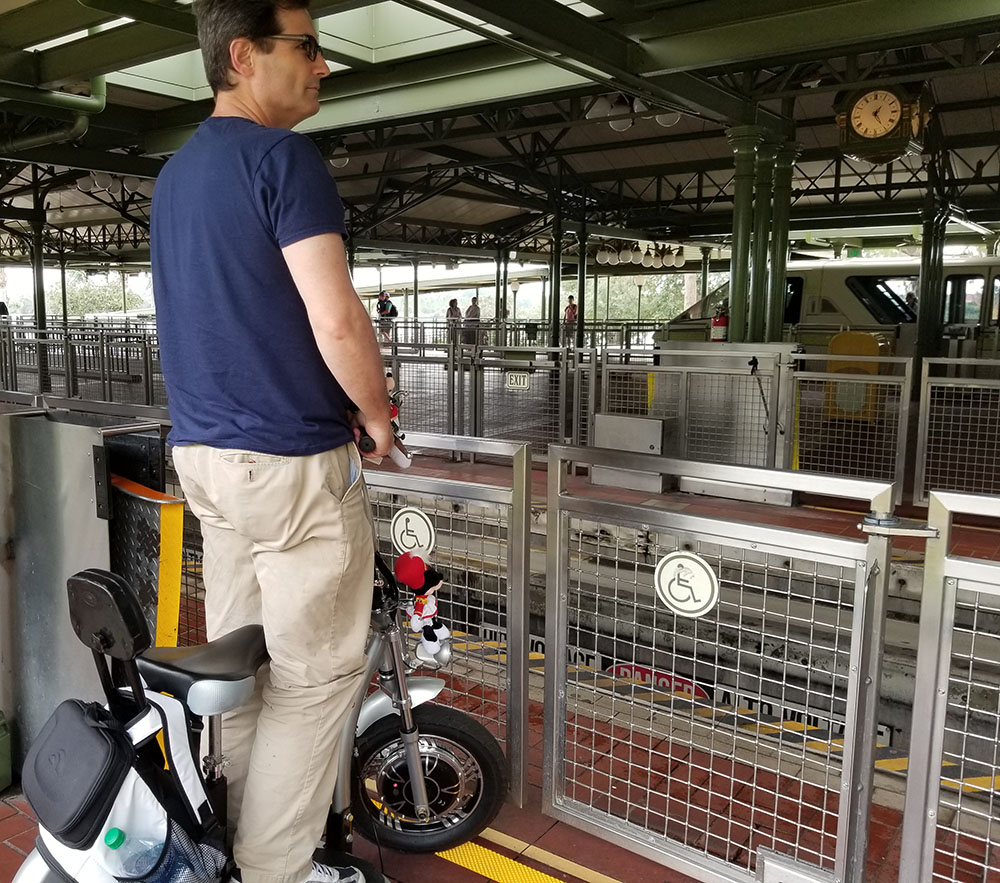 Scooter waiting for the Disney Monorail